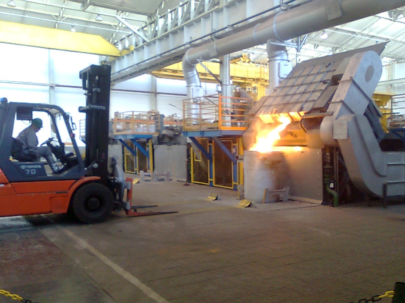 CIME coreless induction furnace pouring molten metal in a foundry melt shop
